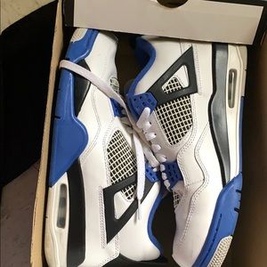 Blue and black Jordan 4s